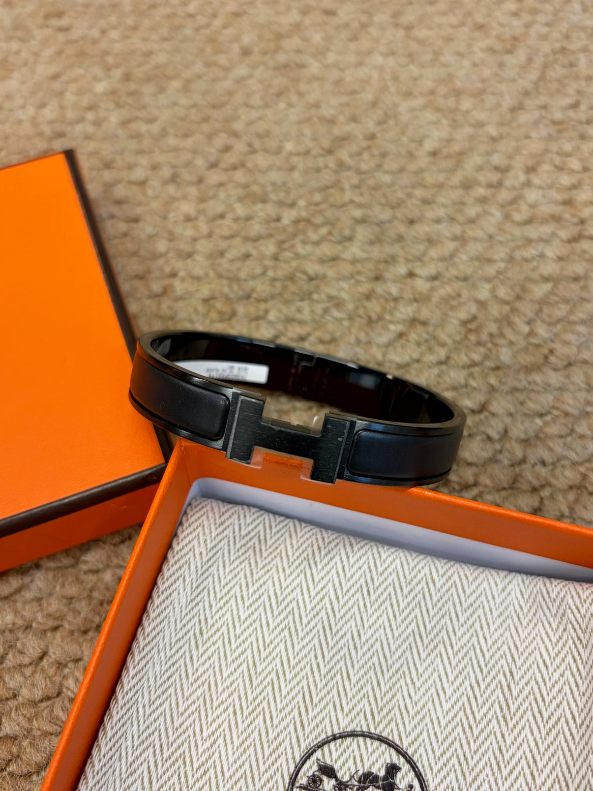 Hermès black H bracelet with box front view